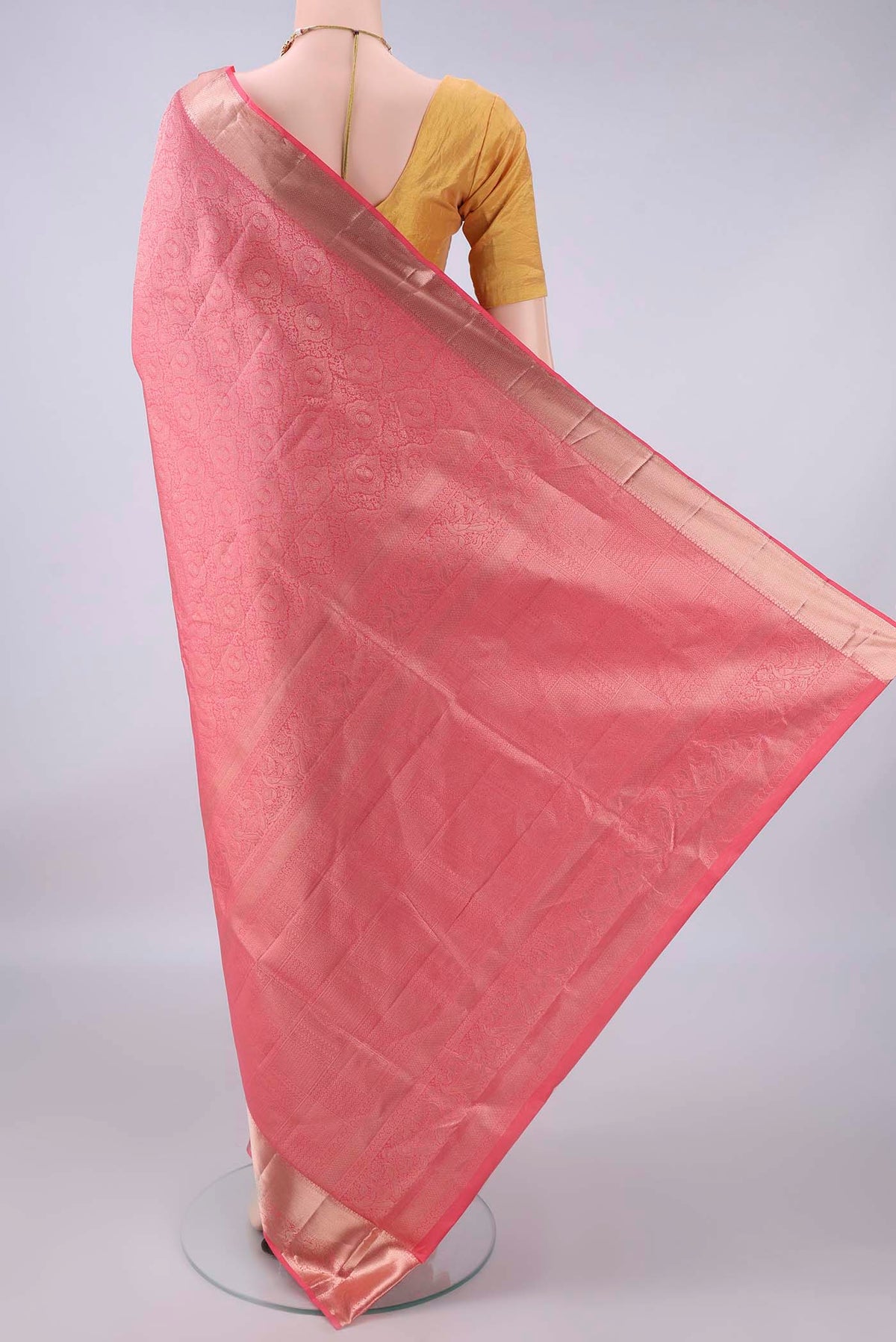Flat view of Pure Silk Peach Soft Saree with Zari Brocade on the body and Zari Border. 