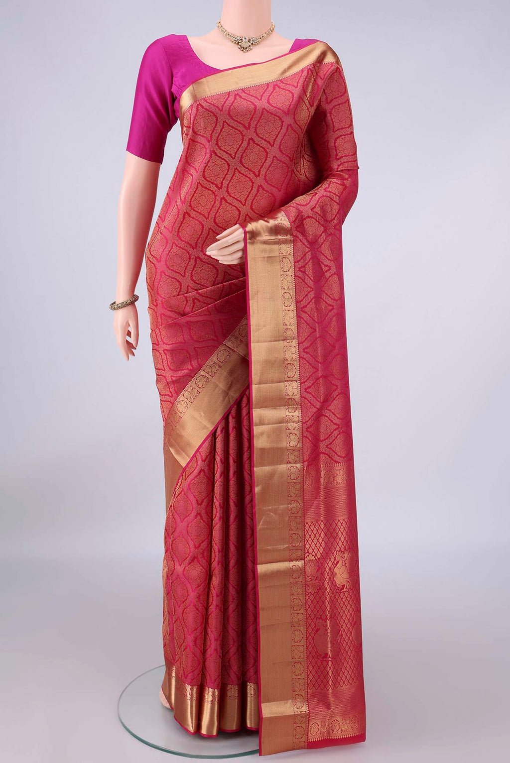 Pure Silk Rani Pink Dual Tone Soft Saree with Zari Brocade on the body and Zari Border.  displayed on a mannequin