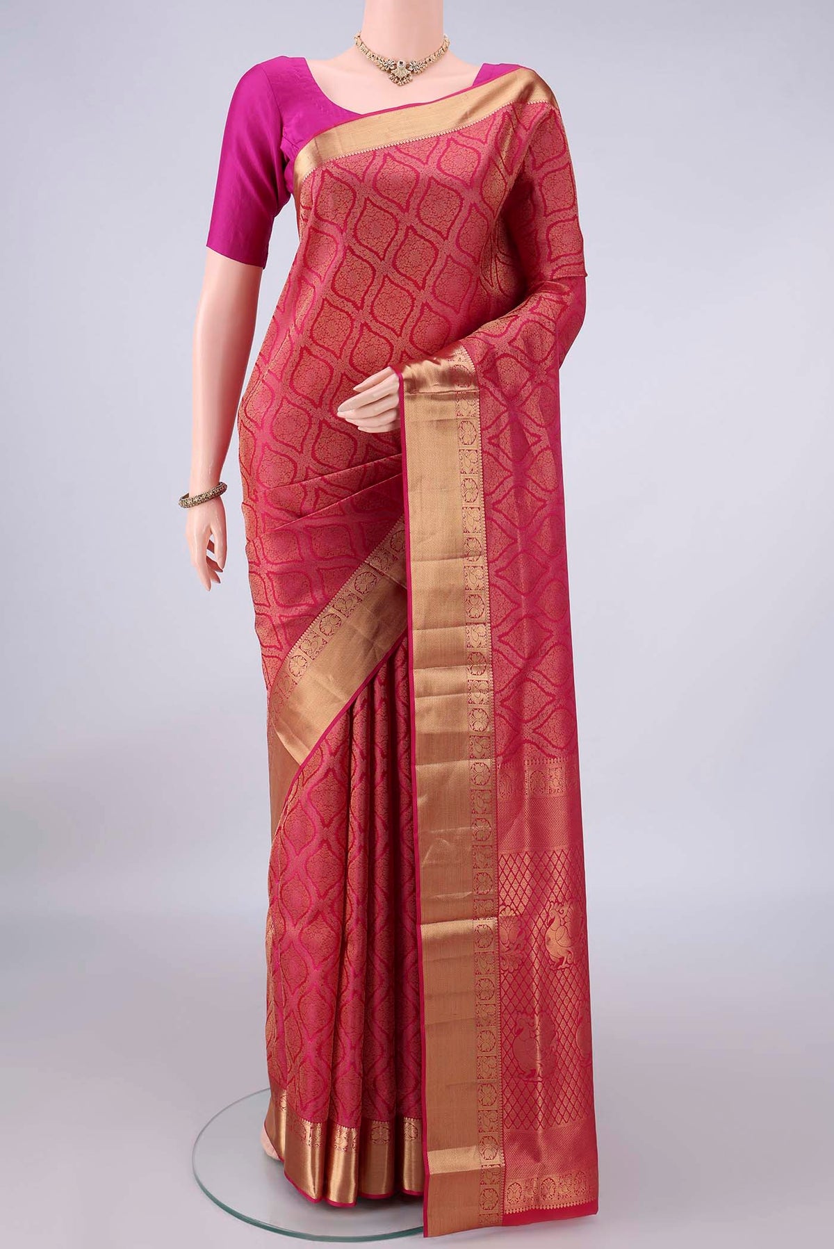 Pure Silk Rani Pink Dual Tone Soft Saree with Zari Brocade on the body and Zari Border.  displayed on a mannequin