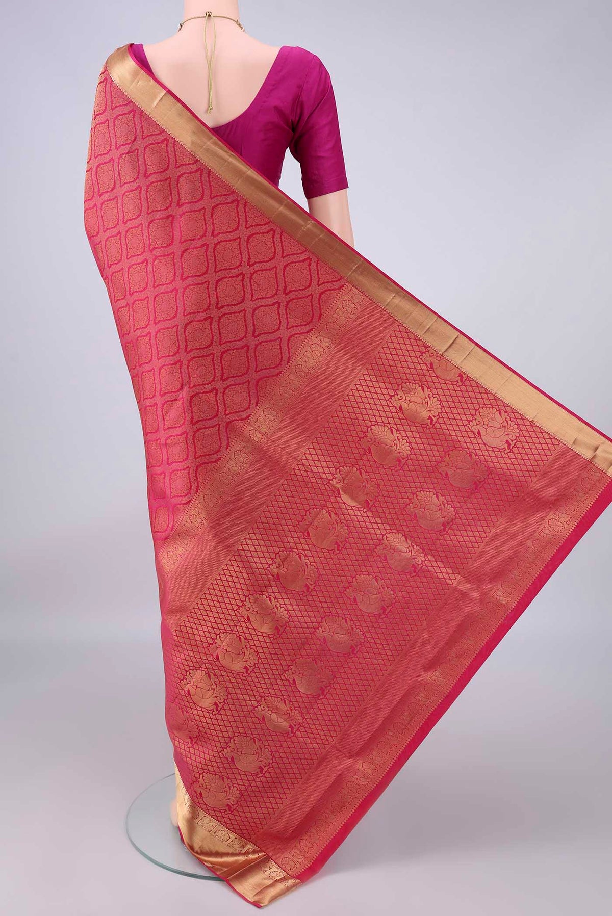 Flat view of Pure Silk Rani Pink Dual Tone Soft Saree with Zari Brocade on the body and Zari Border. 
