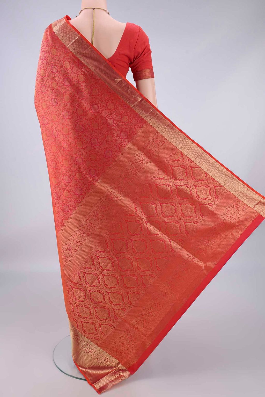 Flat view of Pure Silk Brick Orange Dual Tone Soft Saree with Zari Brocade on the body and Zari Border. 