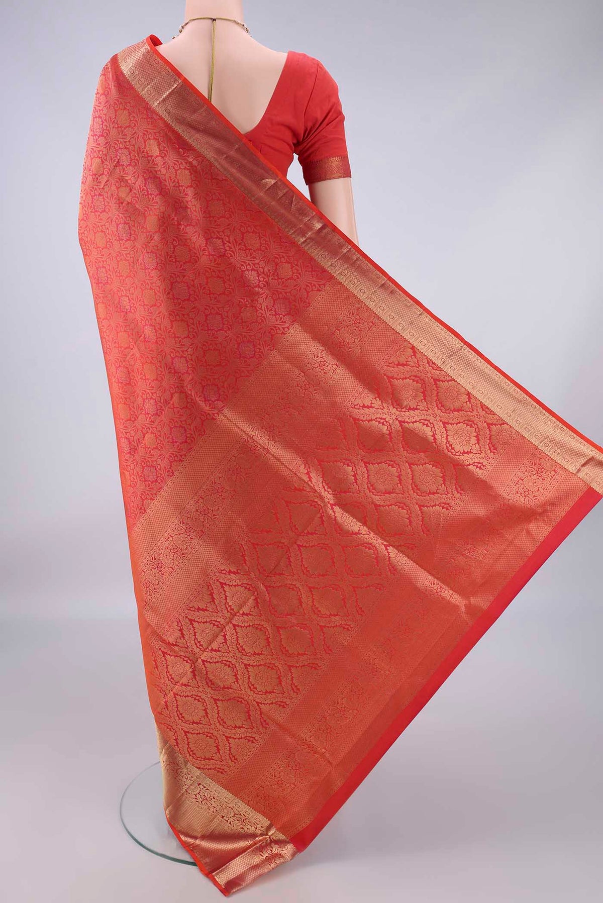 Flat view of Pure Silk Brick Orange Dual Tone Soft Saree with Zari Brocade on the body and Zari Border. 