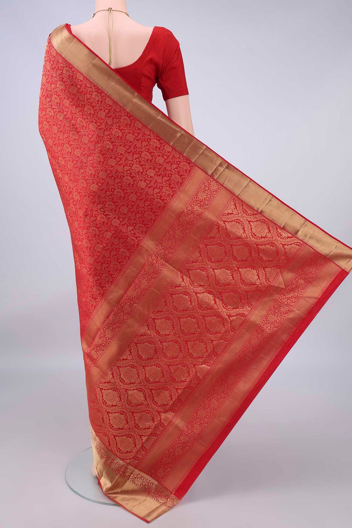 Flat view of Pure Silk Red Soft Saree with Zari Brocade on the body and Zari Border. 