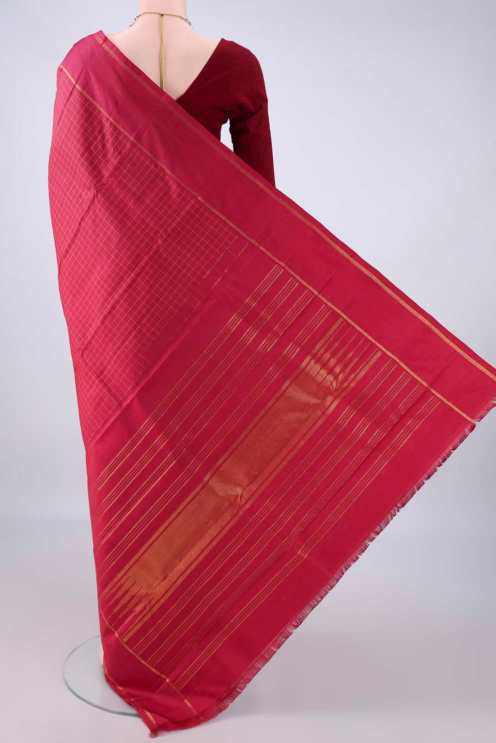 Flat view of Pure Silk Maroon Kanchipuram Saree with Checked design on the body and Zari Border. 