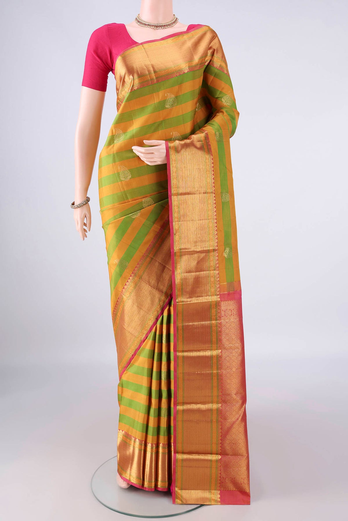 Pure Silk Multi Color Kanjivaram Saree with Stripes on the body and Zari Border.  displayed on a mannequin