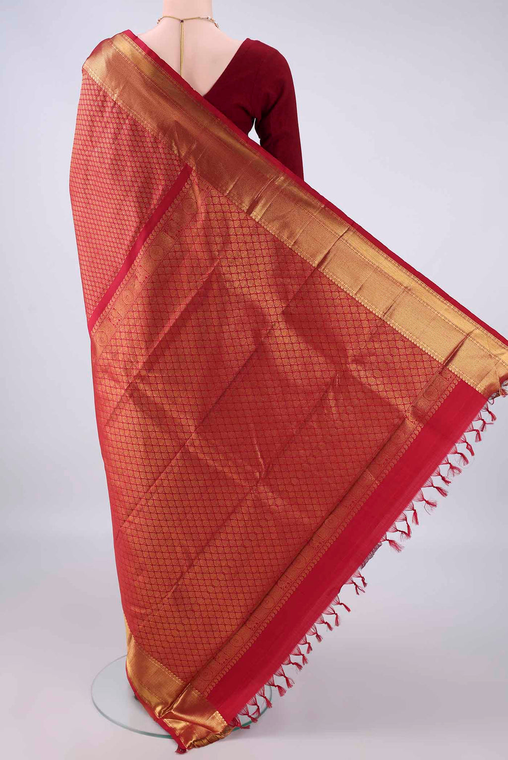 Flat view of Pure Silk Maroon Kanjivaram Saree with Zari Brocade on the body and Zari Border. 