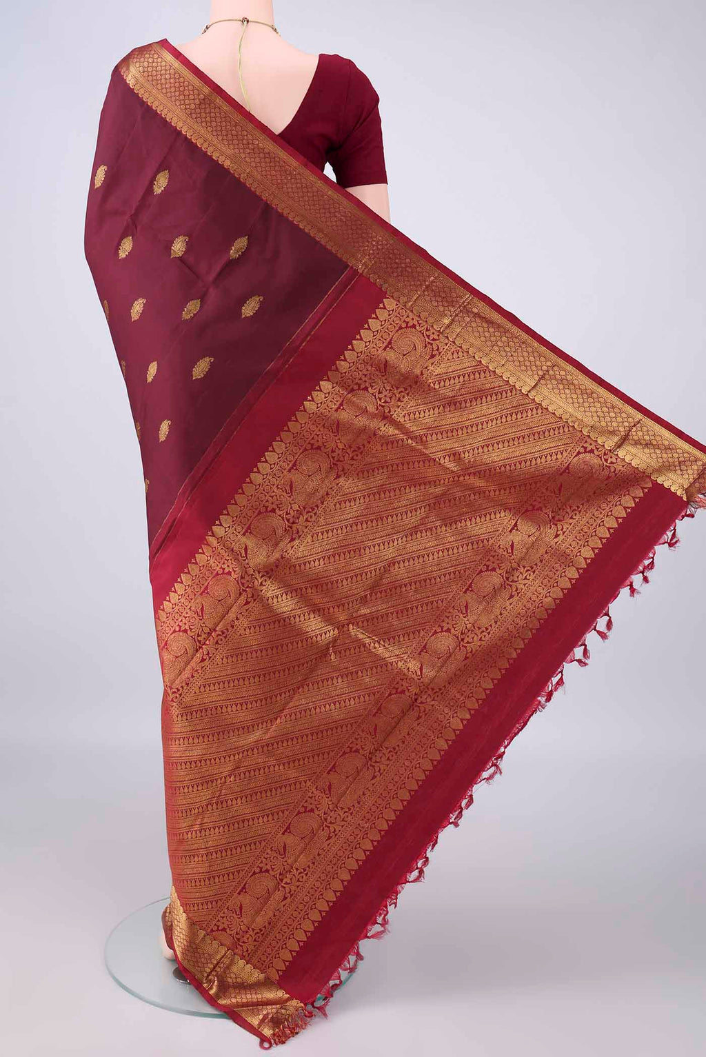 Flat view of Pure Silk Coffee Brown Kanjivaram Saree with Zari Butta on the body and Zari Border. 