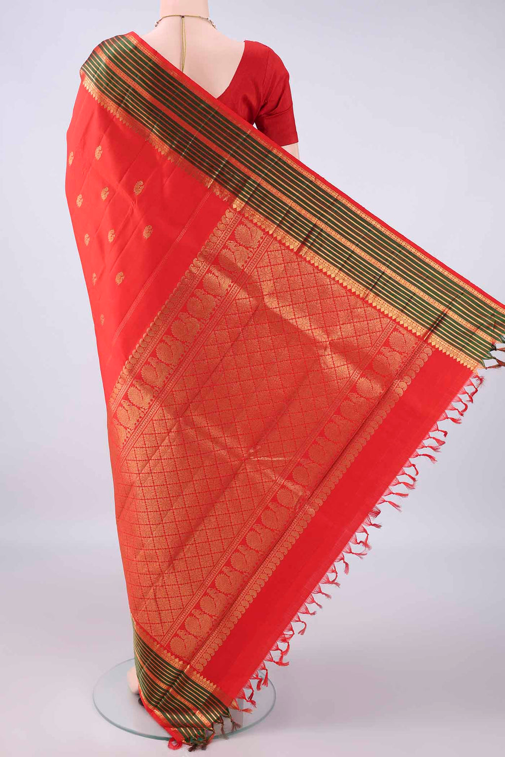 Flat view of Pure Silk Red Kanjivaram Saree with Zari Butta on the body and Zari Border. 