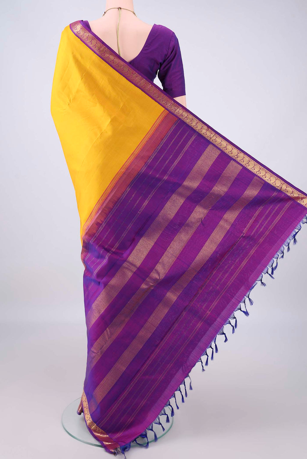 Flat view of Pure Silk Yellow Kanjivaram Saree with Plain Body and Zari Border. 