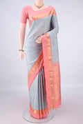 Pure Silk Grey Dual Tone Kanjivaram Saree with Thread Butta on the body and Zari Border.  displayed on a mannequin
