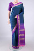 Pure Silk Peacock Blue Dual Tone Kanjivaram Saree with Plain Body and Zari Border.  displayed on a mannequin
