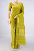 Pure Silk Parrot Green Kanchipuram Saree with Checked design on the body and Zari Border.  displayed on a mannequin