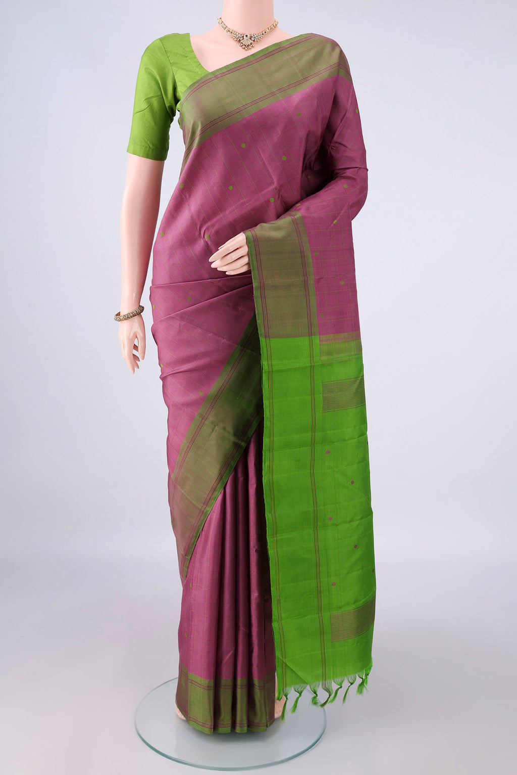 Pure Silk Mauve Kanchipuram Saree with Checked design on the body and Plain Border.  displayed on a mannequin