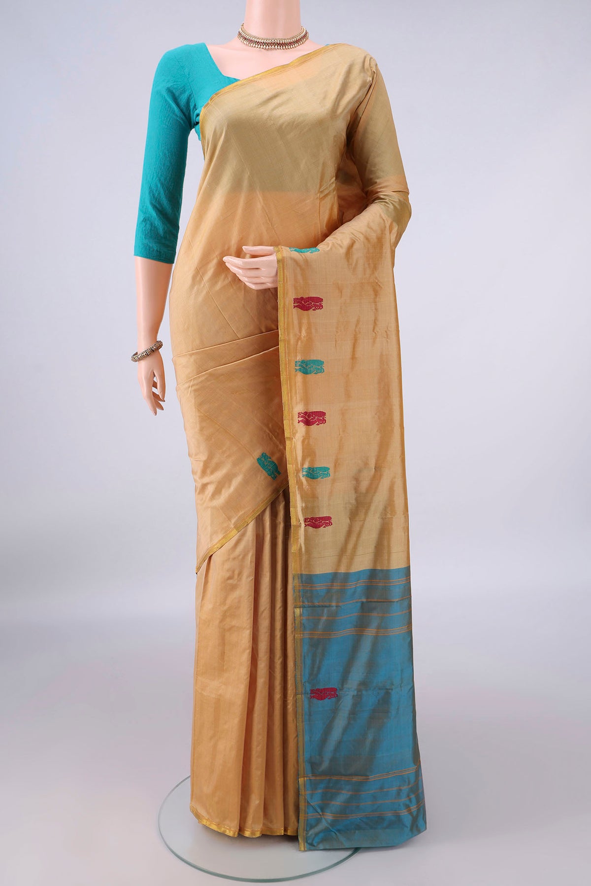 Pure Silk Sandal Kanchipuram Saree with Plain Body and Zari Border.  displayed on a mannequin