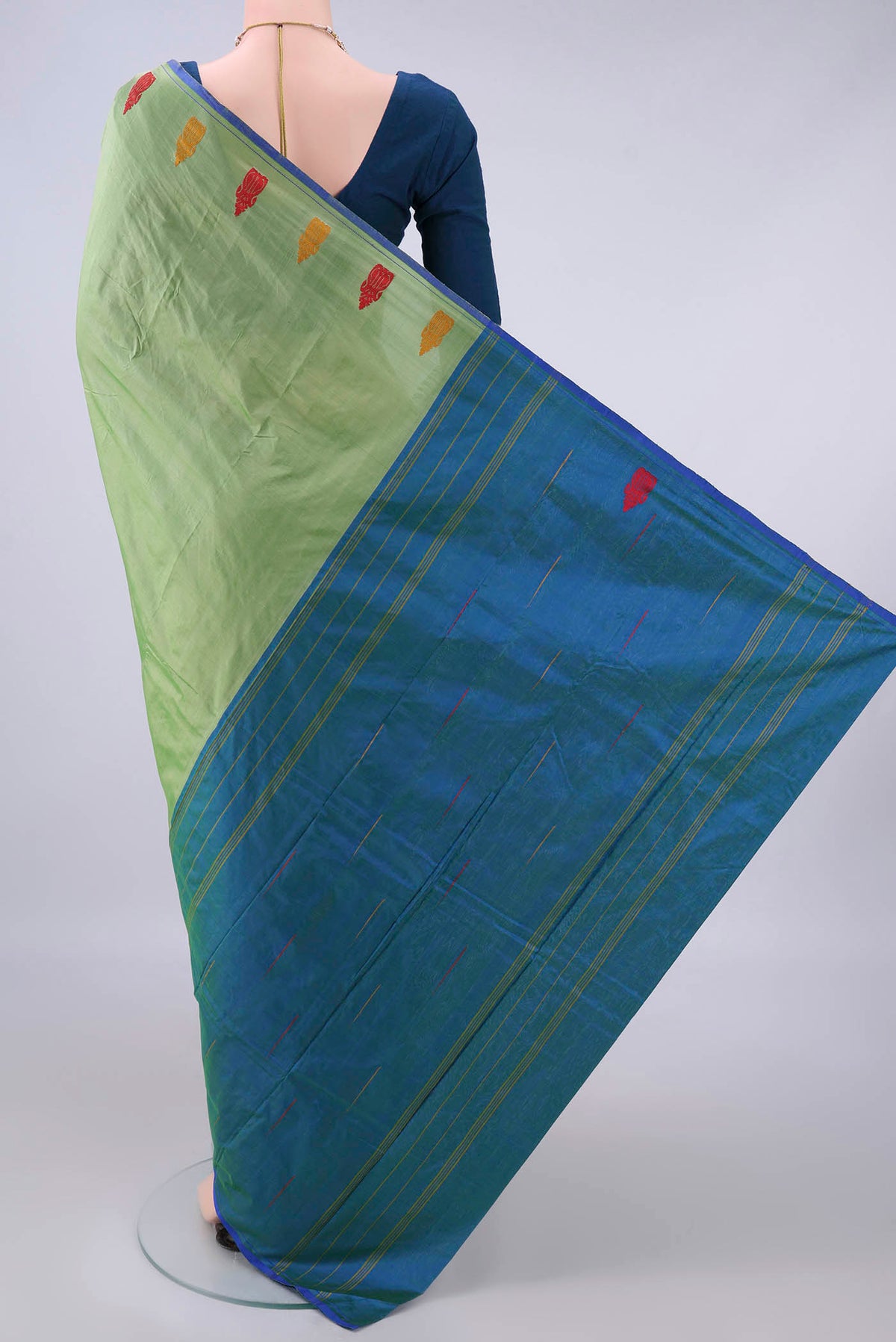 Flat view of Pure Silk Light Green Kanchipuram Saree with Plain Body and Thread Border. 