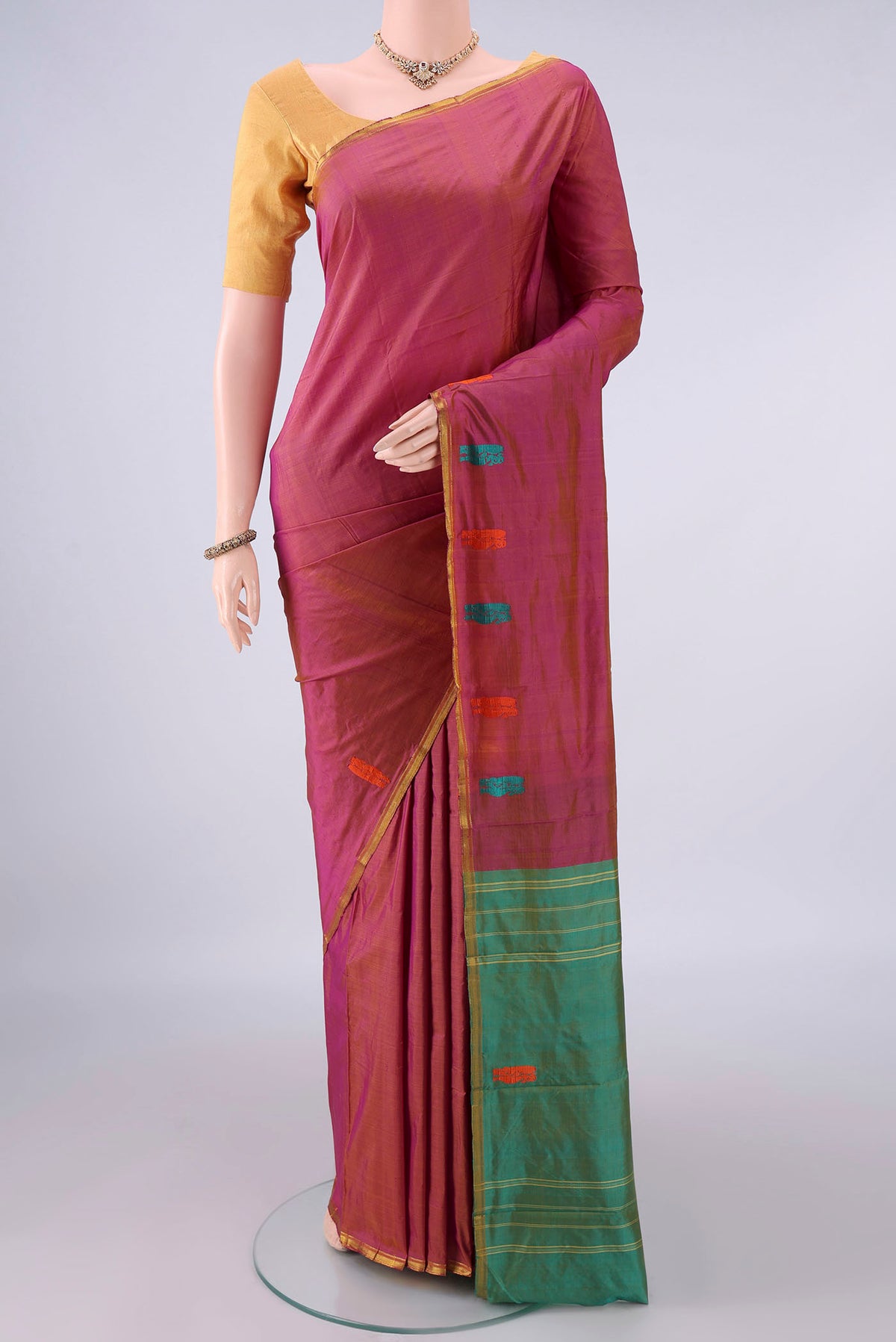 Pure Silk Pink with Orange Color Kanchipuram Saree with Plain Body and Zari Border.  displayed on a mannequin