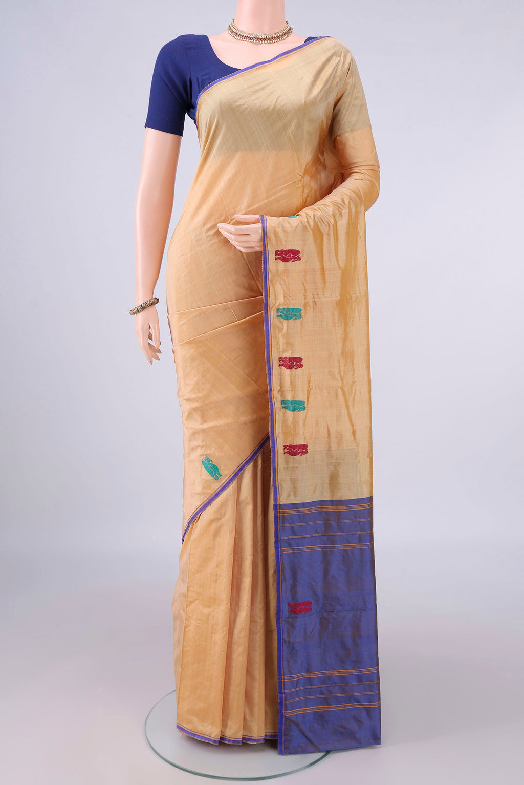 Pure Silk Sandal Kanchipuram Saree with Plain Body and Thread Border.  displayed on a mannequin