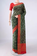 Green Mysore Crepe Saree with Printed design on the body and Zari Border.  displayed on a mannequin