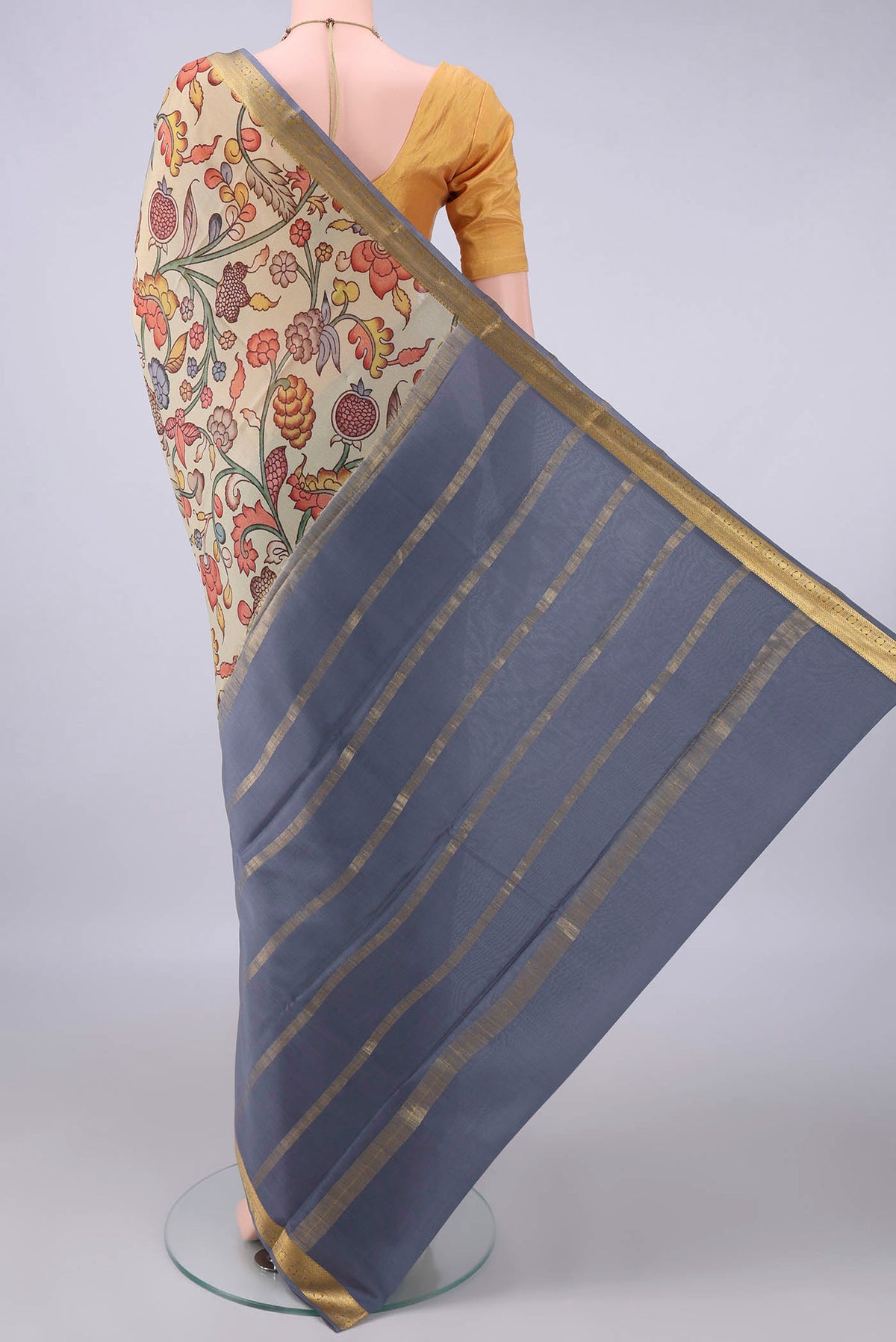 Flat view of Dark Beige Mysore Crepe Saree with Printed design on the body and Zari Border. 