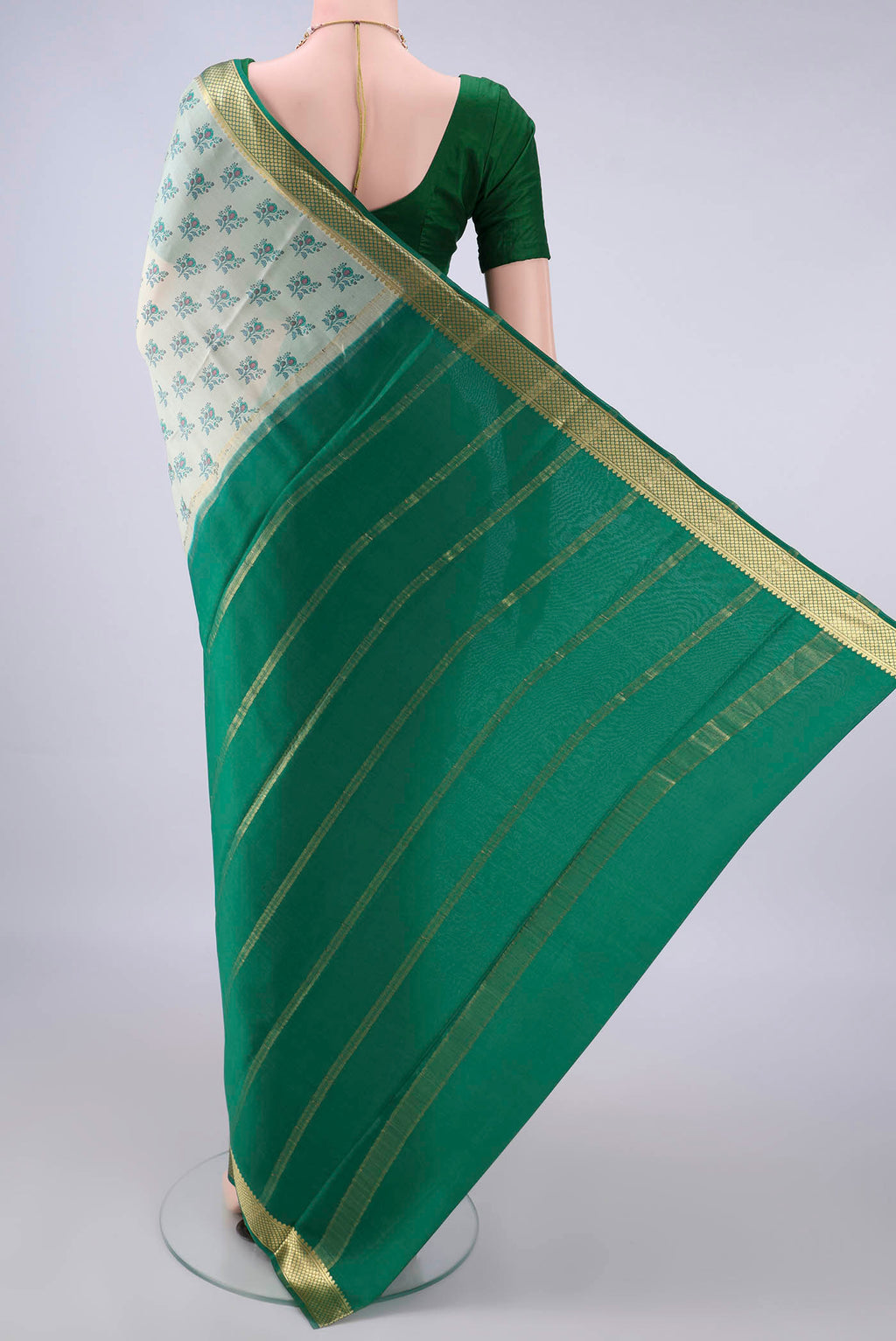 Flat view of Off White Mysore Crepe Saree with Printed design on the body and Zari Border. 