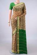 Dark Beige Mysore Crepe Saree with Printed design on the body and Zari Border.  displayed on a mannequin