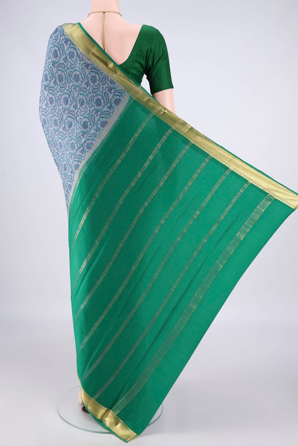 Flat view of Grey Mysore Crepe Saree with Printed design on the body and Zari Border. 