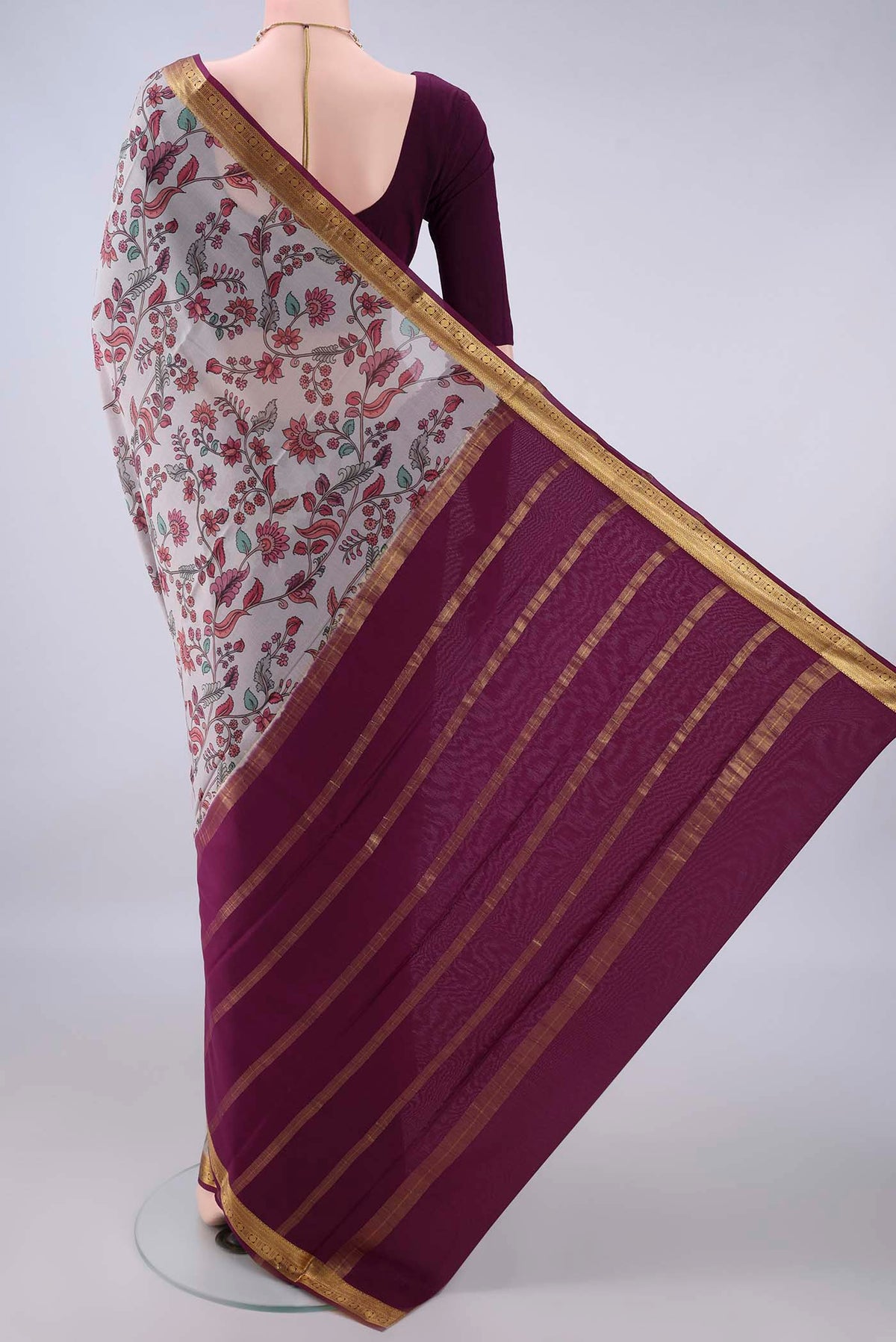 Flat view of Grey Mysore Crepe Saree with Printed design on the body and Zari Border. 