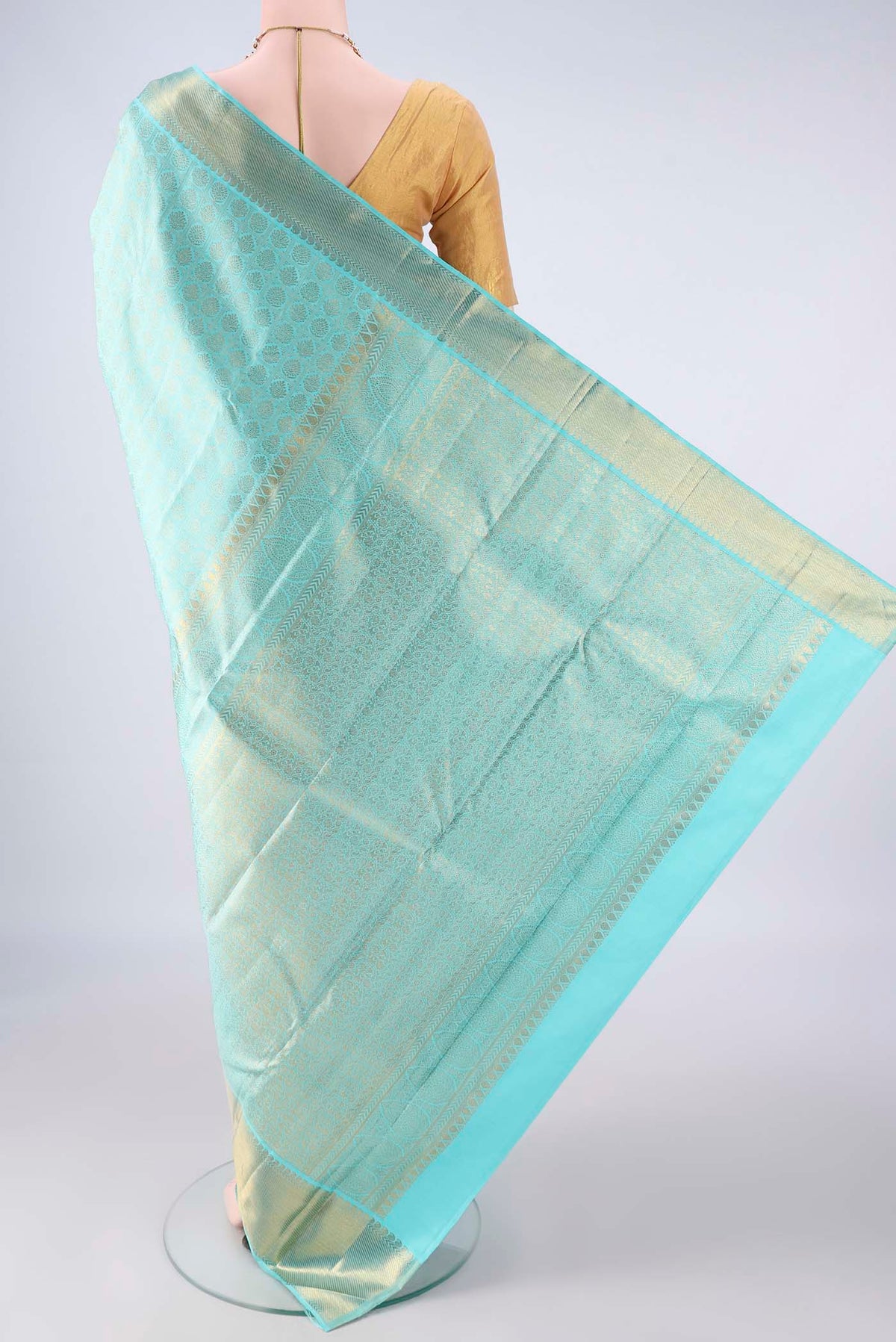 Flat view of Pure Silk Turquoise Kanchipuram Saree with Zari Brocade on the body and Zari Border. 