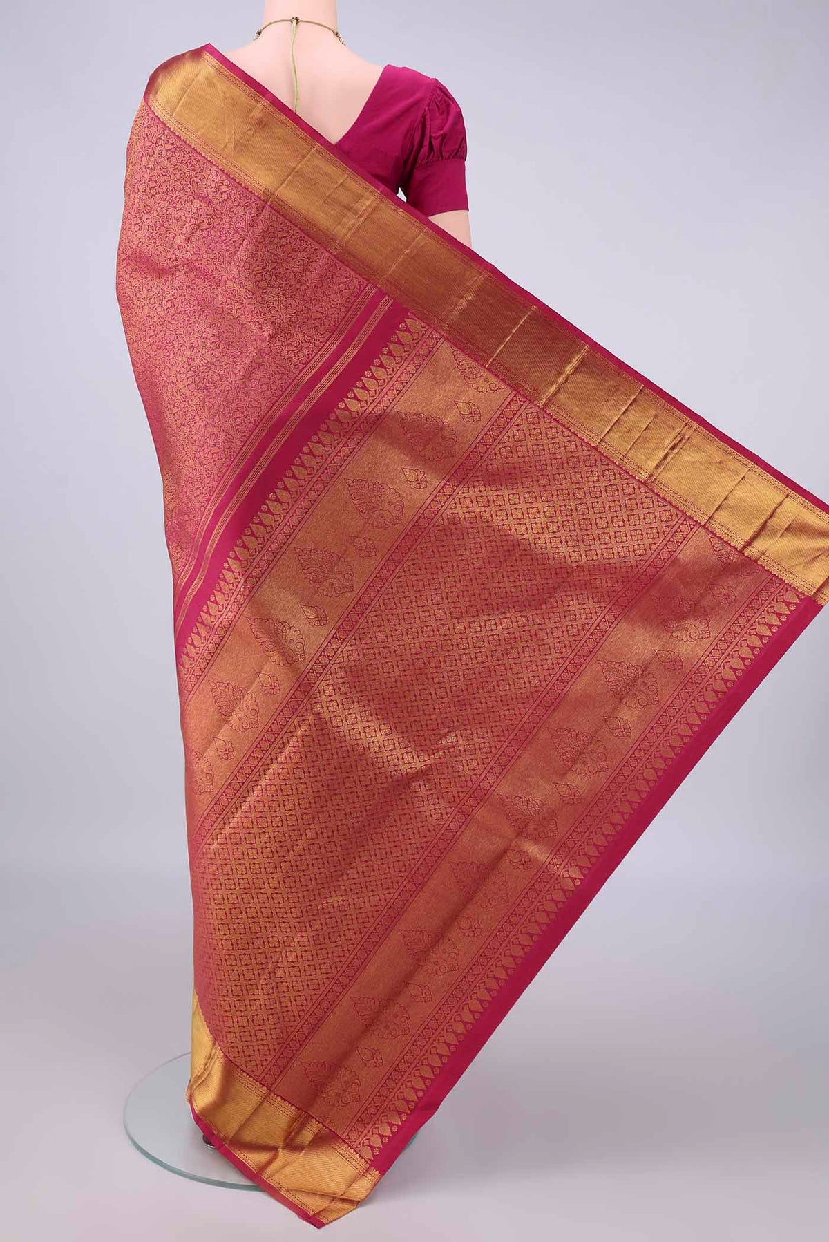 Flat view of Pure Silk Dark Pink Kanchipuram Saree with Zari Brocade on the body and Zari Border. 