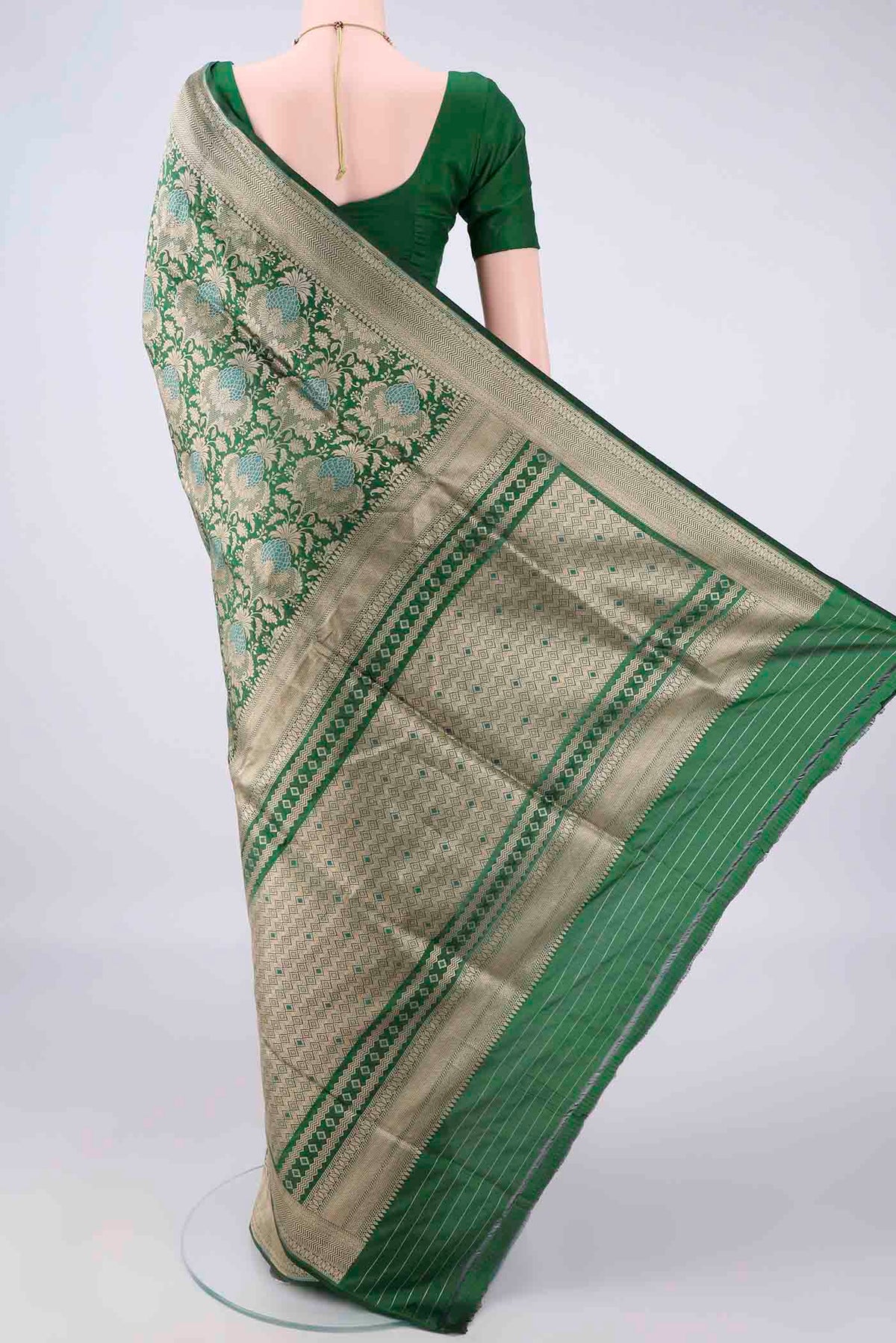 Flat view of Pure Silk Green Banarasi Saree with Zari Brocade on the body and Zari Border. 