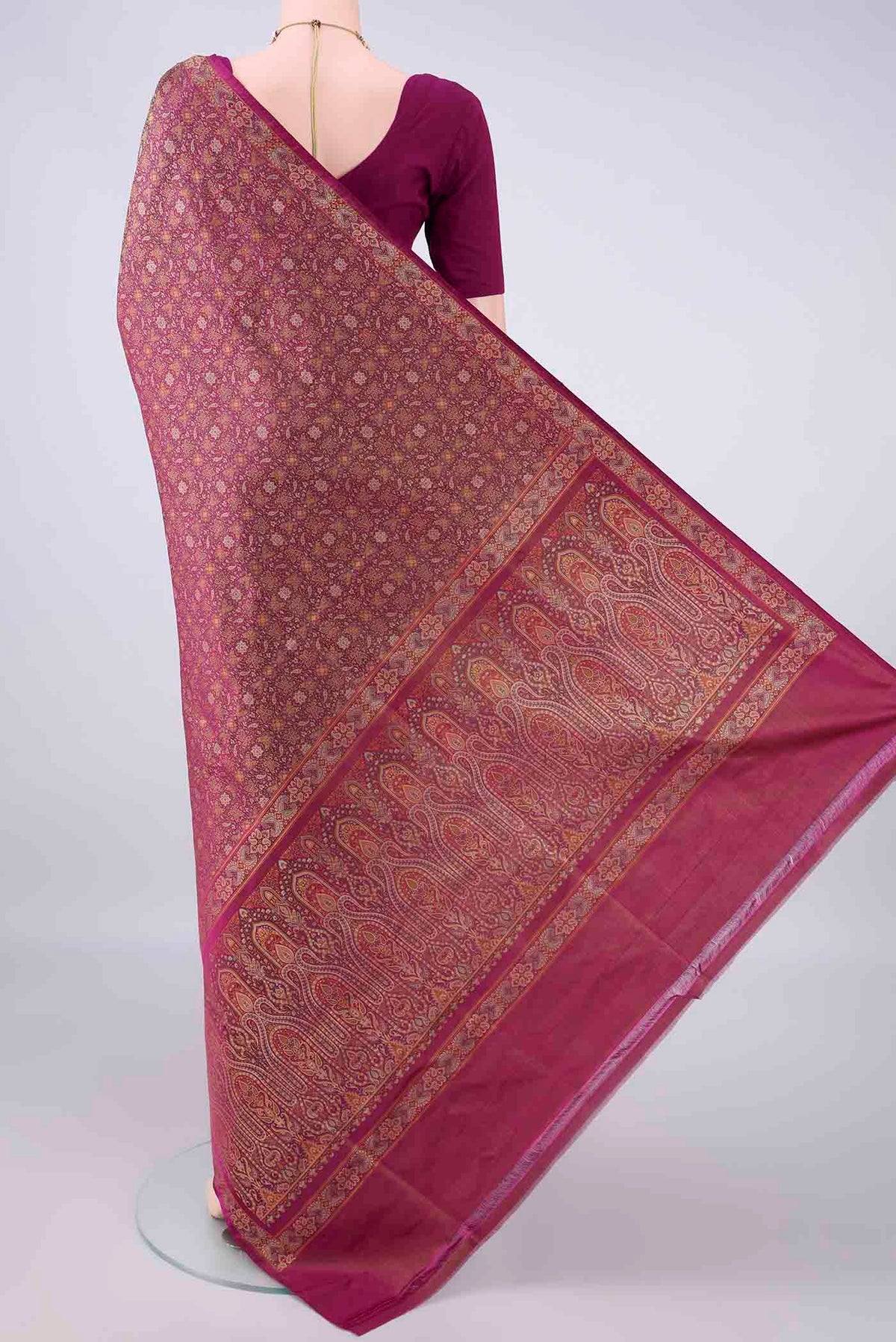 Flat view of Pure Silk Magenta Banarasi Tanchoi Saree with Thread Brocade on the body and Zari And Thread Border. 