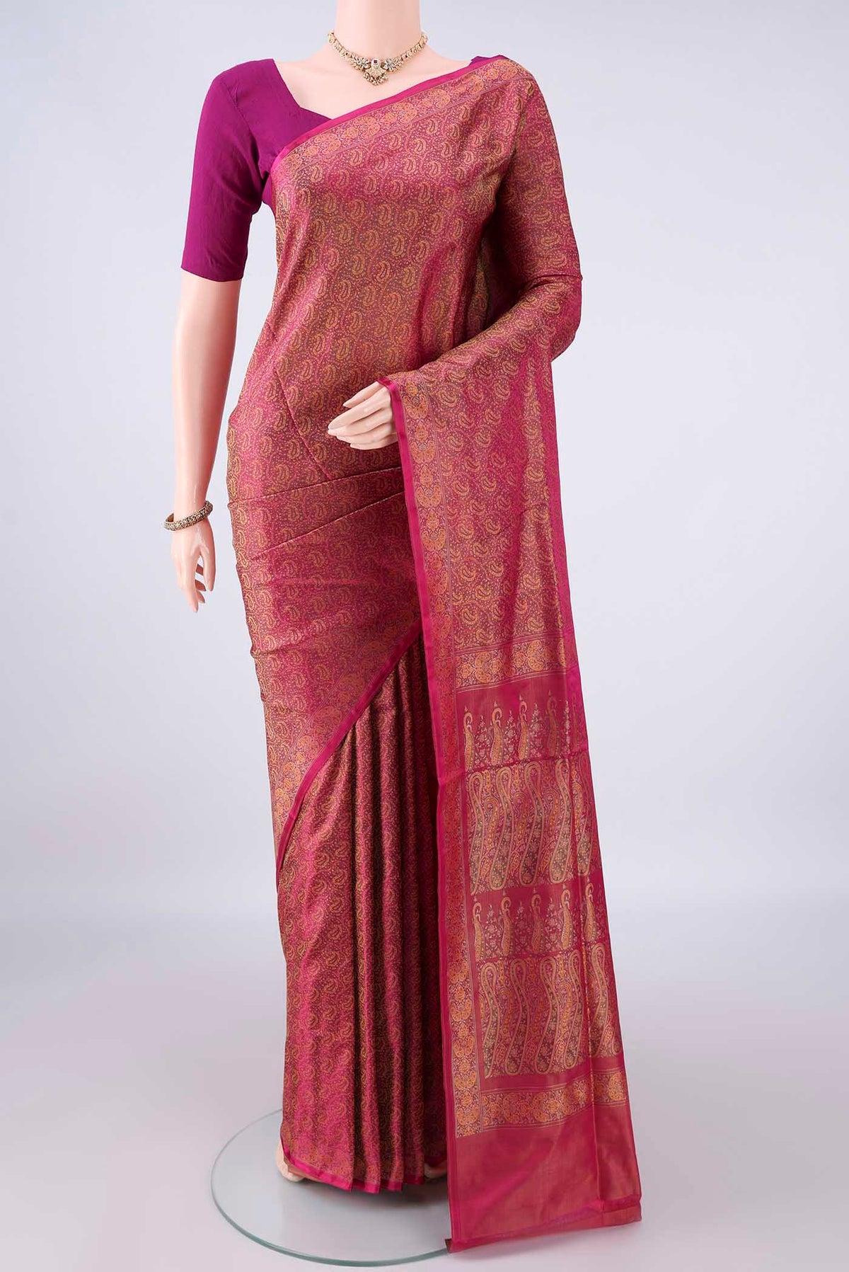 Pure Silk Coral Banarasi Tanchoi Saree with Thread Brocade on the body and Zari And Thread Border.  displayed on a mannequin