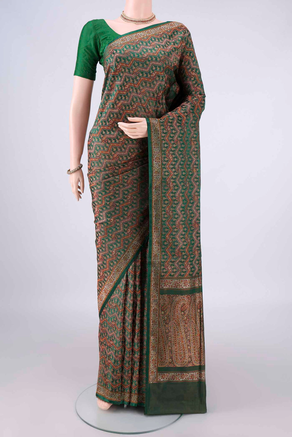 Pure Silk Bottle Green Banarasi Tanchoi Saree with Jacquard With Thread Butta on the body and Thread Border.  displayed on a mannequin