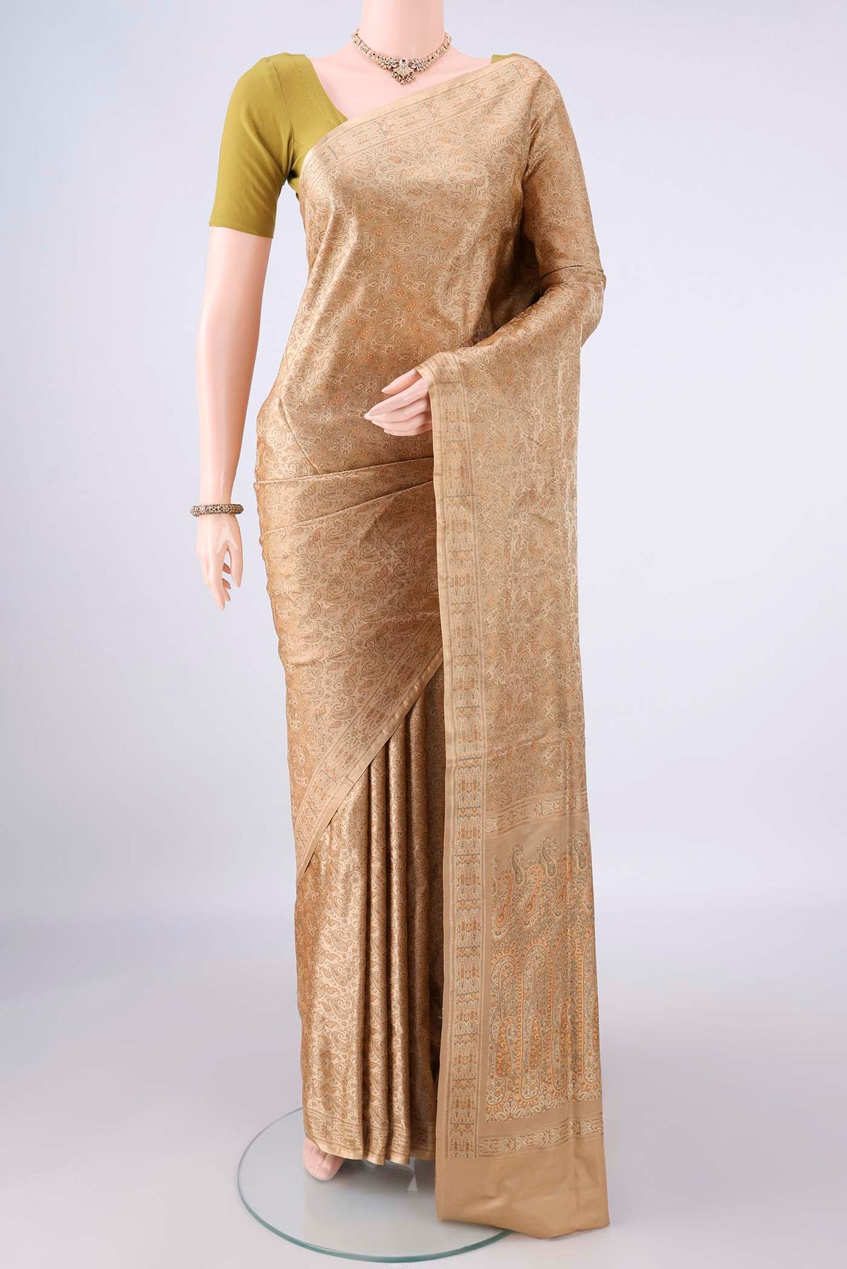 Pure Silk Beige Banarasi Tanchoi Saree with Thread Brocade on the body and Zari And Thread Border.  displayed on a mannequin