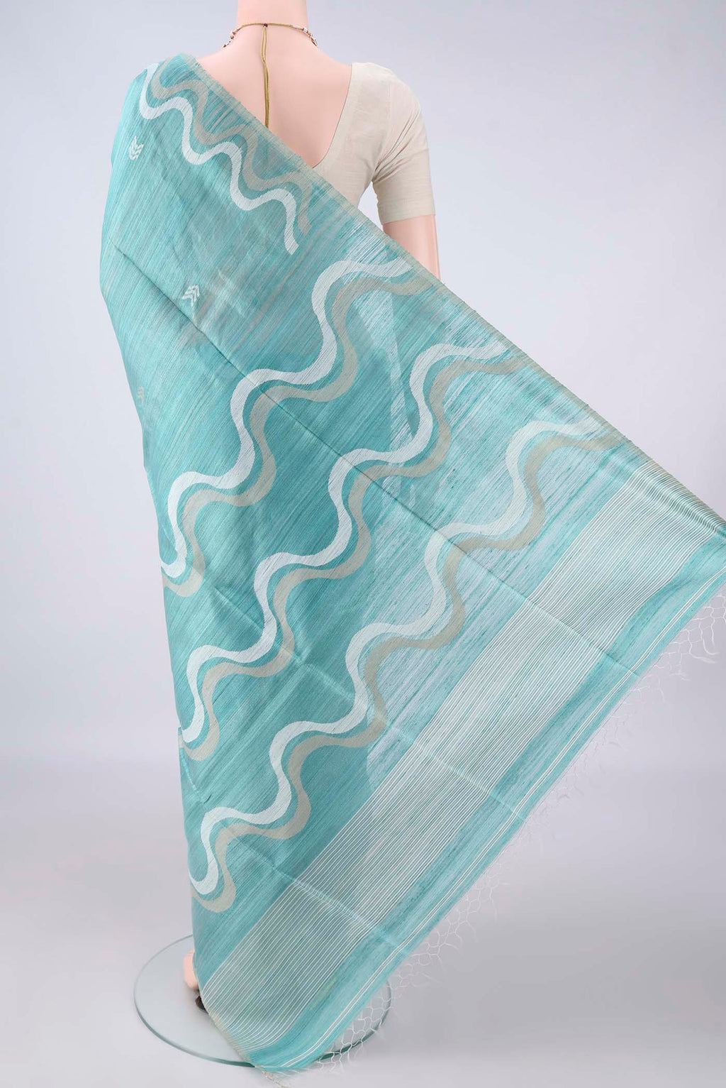 Flat view of Pure Silk Sea Green Jute Saree with Jamdani on the body and Plain Border. 