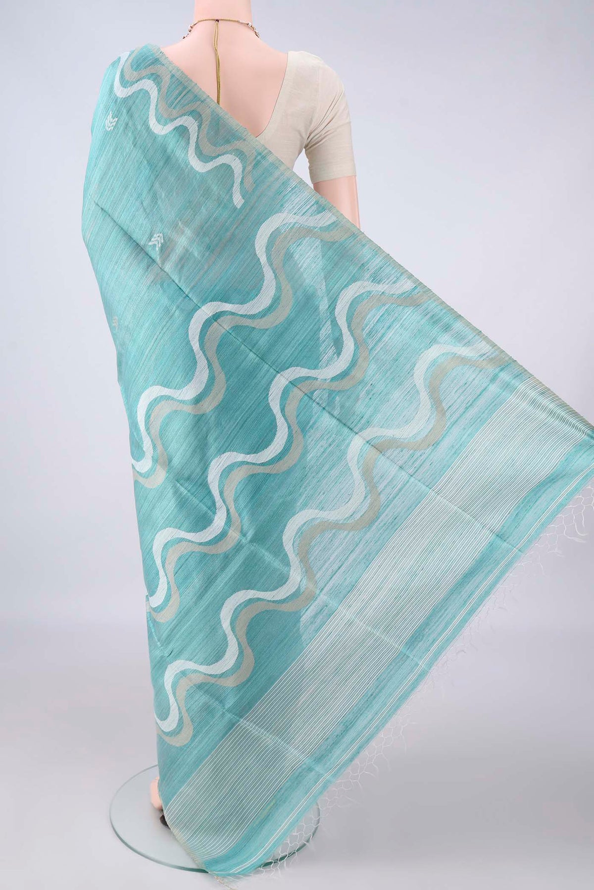 Flat view of Pure Silk Sea Green Jute Saree with Jamdani on the body and Plain Border. 