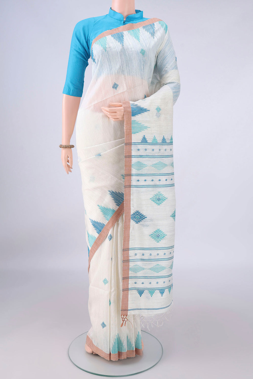 Pure Silk White Jute Saree with Jamdani on the body and Temple Border.  displayed on a mannequin