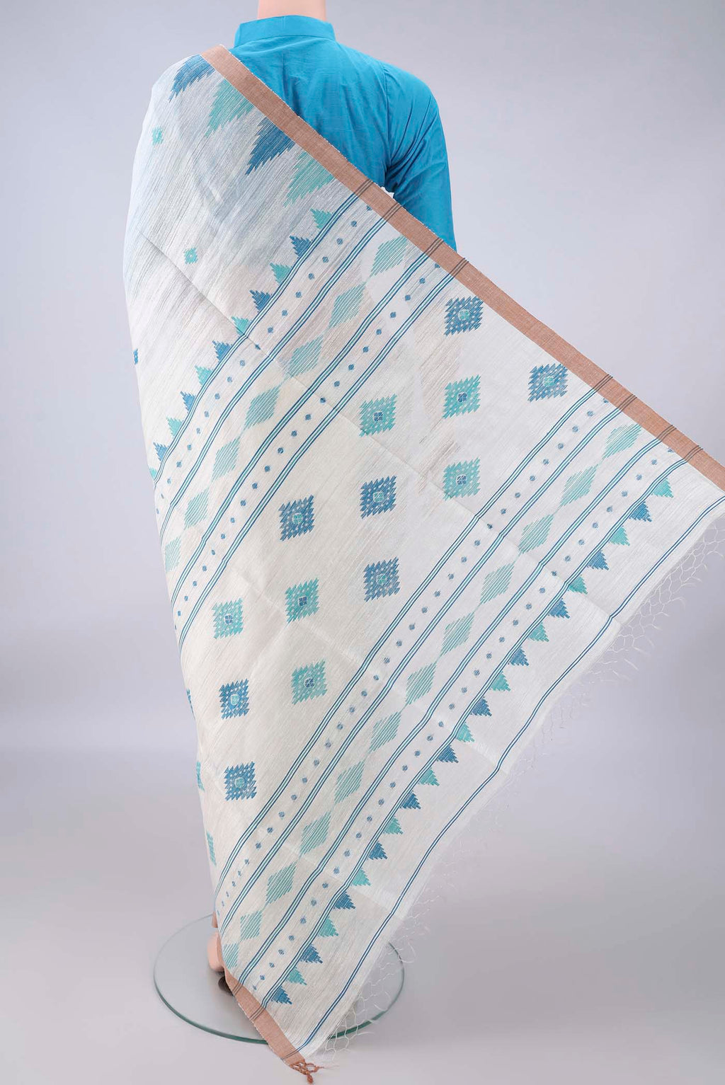Flat view of Pure Silk White Jute Saree with Jamdani on the body and Temple Border. 