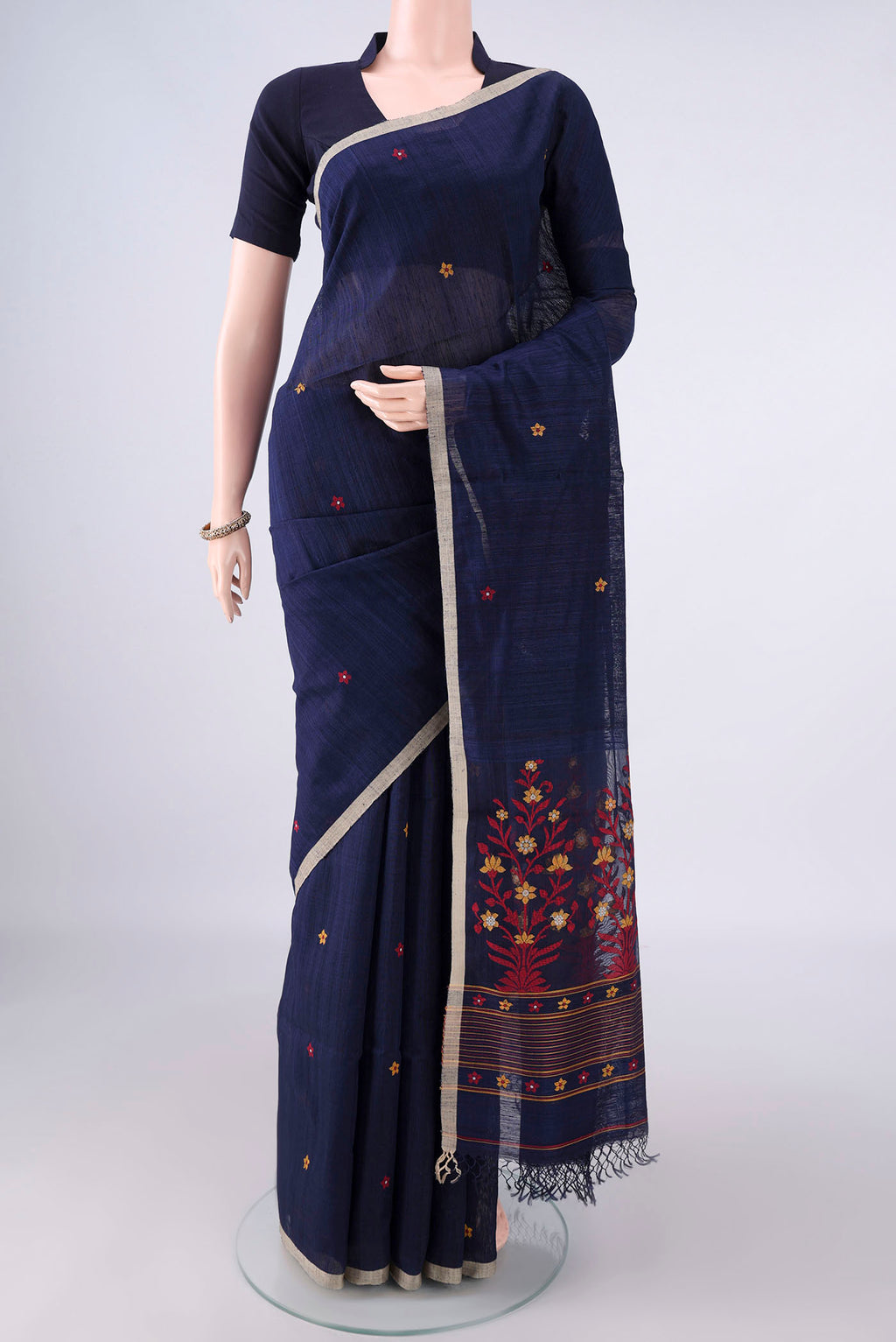 Pure Silk Navy Blue Jute Saree with Jamdani on the body and Plain Border.  displayed on a mannequin