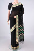 Pure Silk Black Jute Saree with Plain Body and Thread Border.  displayed on a mannequin