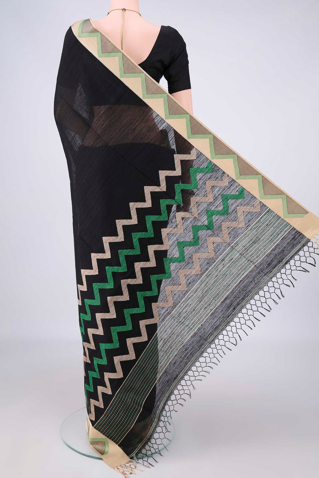 Flat view of Pure Silk Black Jute Saree with Plain Body and Thread Border. 