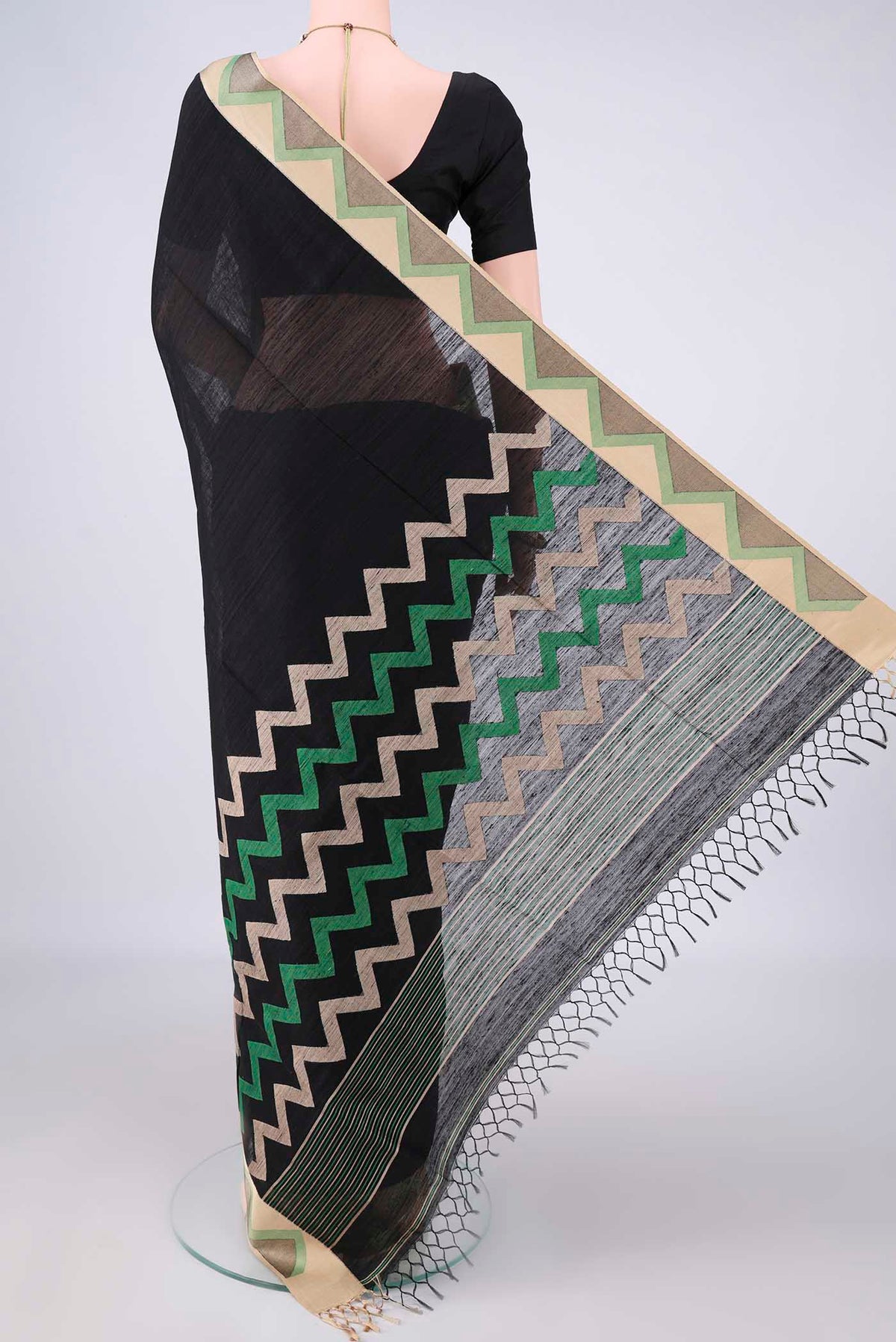 Flat view of Pure Silk Black Jute Saree with Plain Body and Thread Border. 
