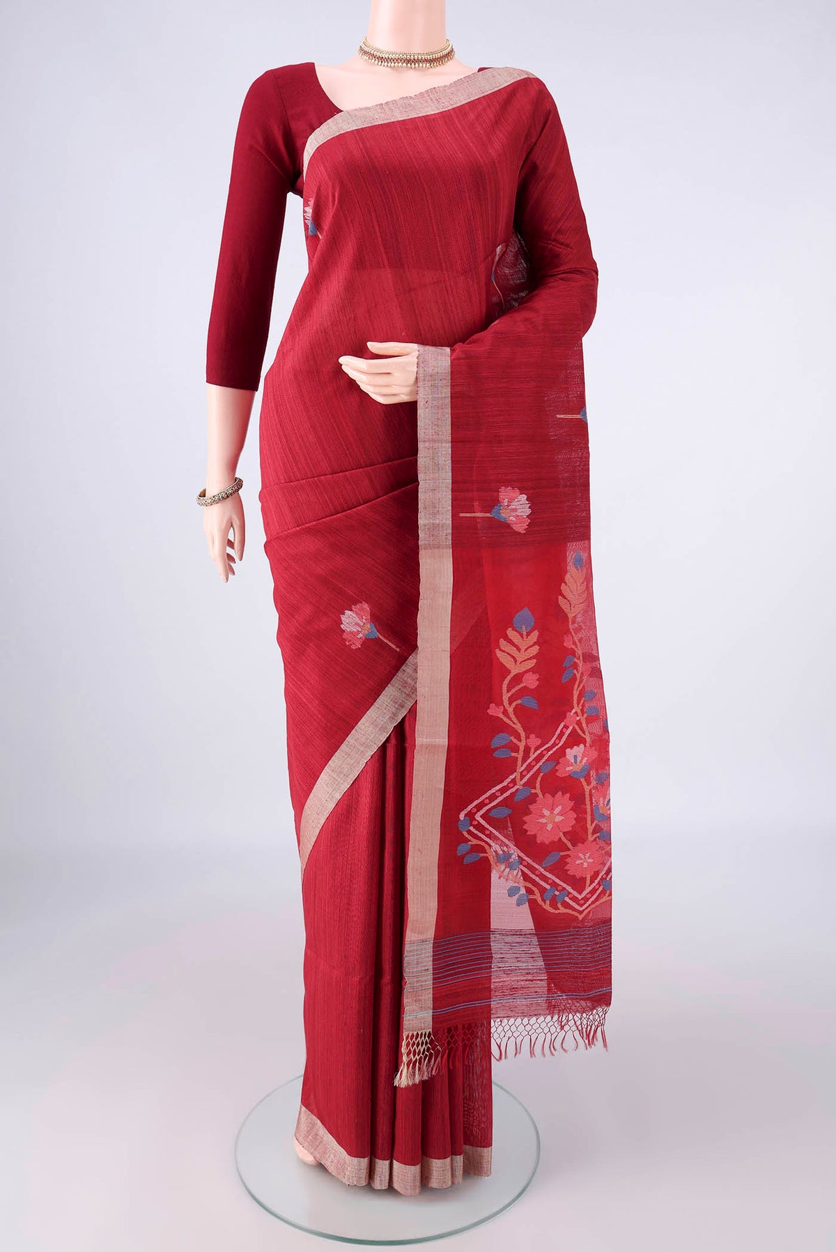 Pure Silk Maroon Jute Saree with Jamdani on the body and Plain Border.  displayed on a mannequin