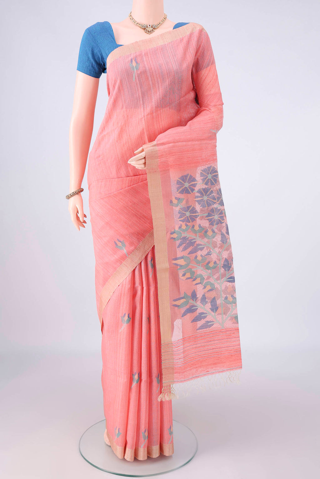 Pure Silk Peach Jute Saree with Jamdani on the body and Plain Border.  displayed on a mannequin