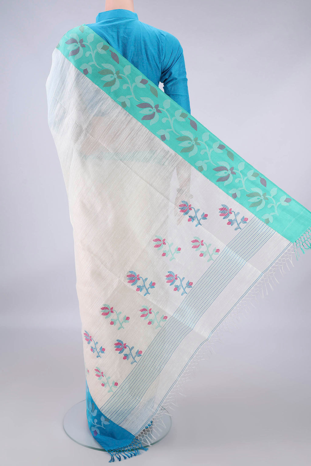 Flat view of Pure Silk White Jute Saree with Jamdani on the body and Ganga Jamuna Border. 