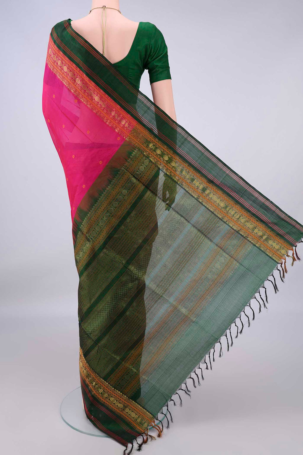 Flat view of Rani Pink Coimbatore Cotton Saree with Thread Butta on the body and Zari Border. 
