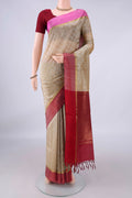 Dark Beige Coimbatore Cotton Saree with Jacquard design on the body and Zari Border.  displayed on a mannequin