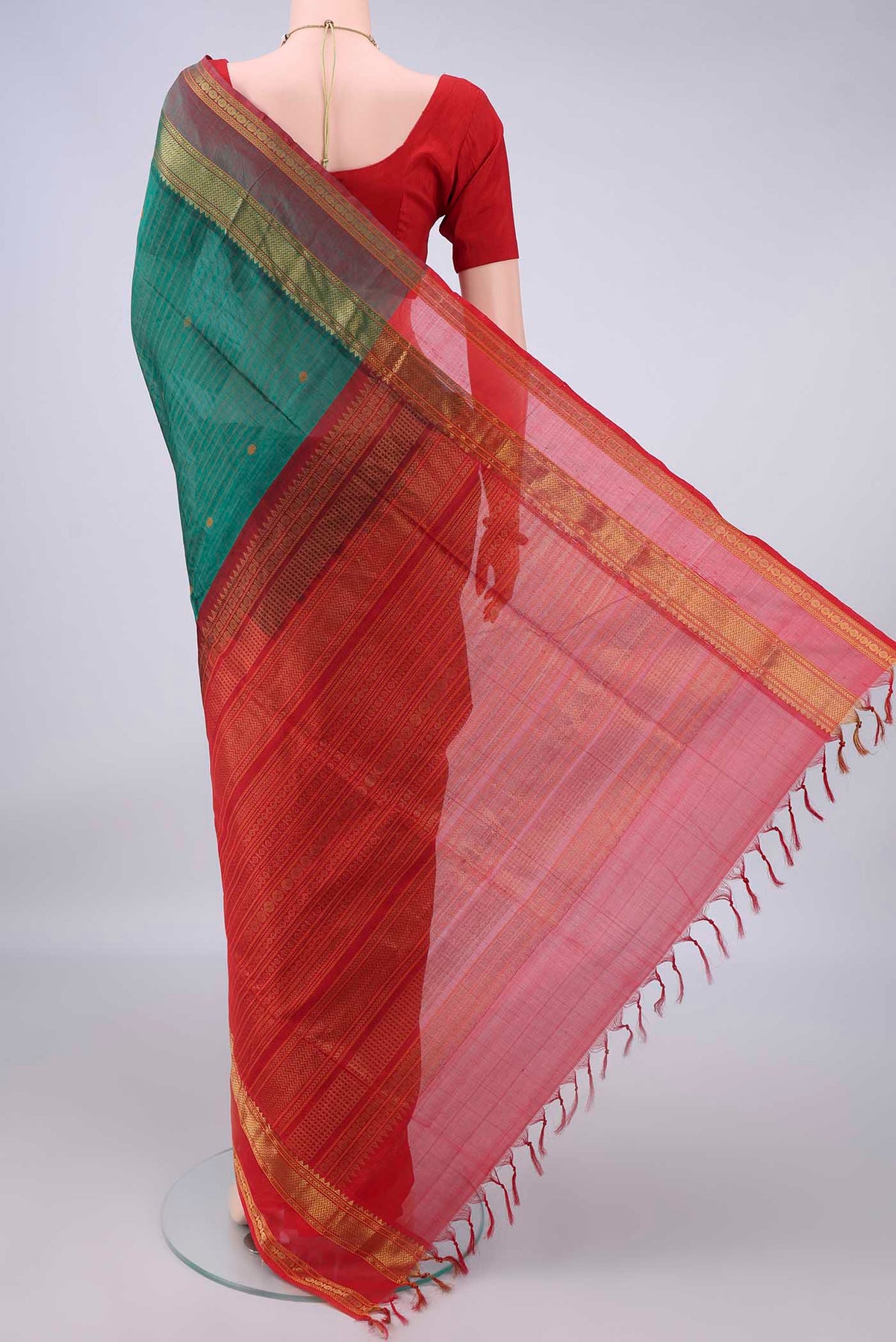 Flat view of Bottle Green Coimbatore Cotton Saree with Stripes on the body and Zari Border. 
