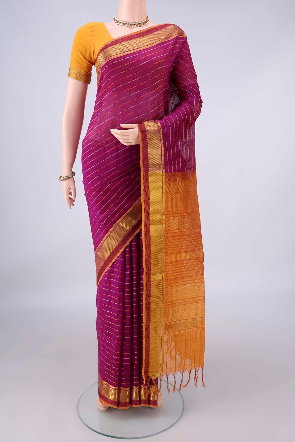 Magenta Coimbatore Cotton Saree with Veldhari on the body and Zari Border.  displayed on a mannequin