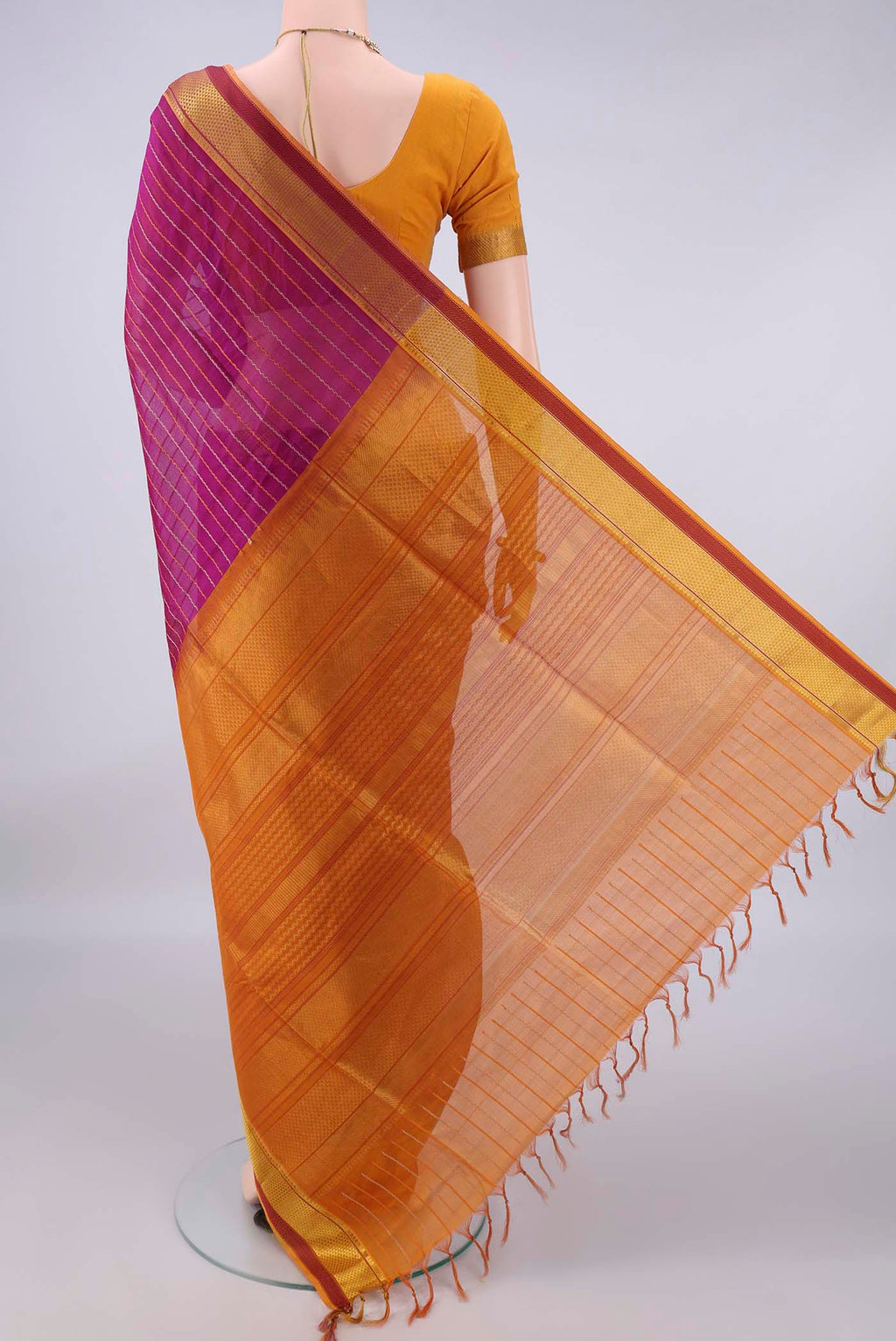 Flat view of Magenta Coimbatore Cotton Saree with Veldhari on the body and Zari Border. 